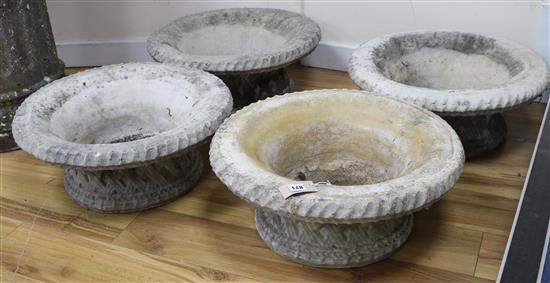 A set of four reconstituted stone basketry effect garden tubs W.54cm approx.